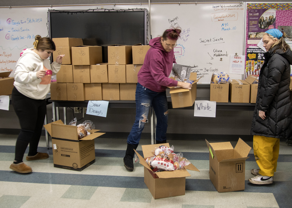 students organize bread orders for delivery