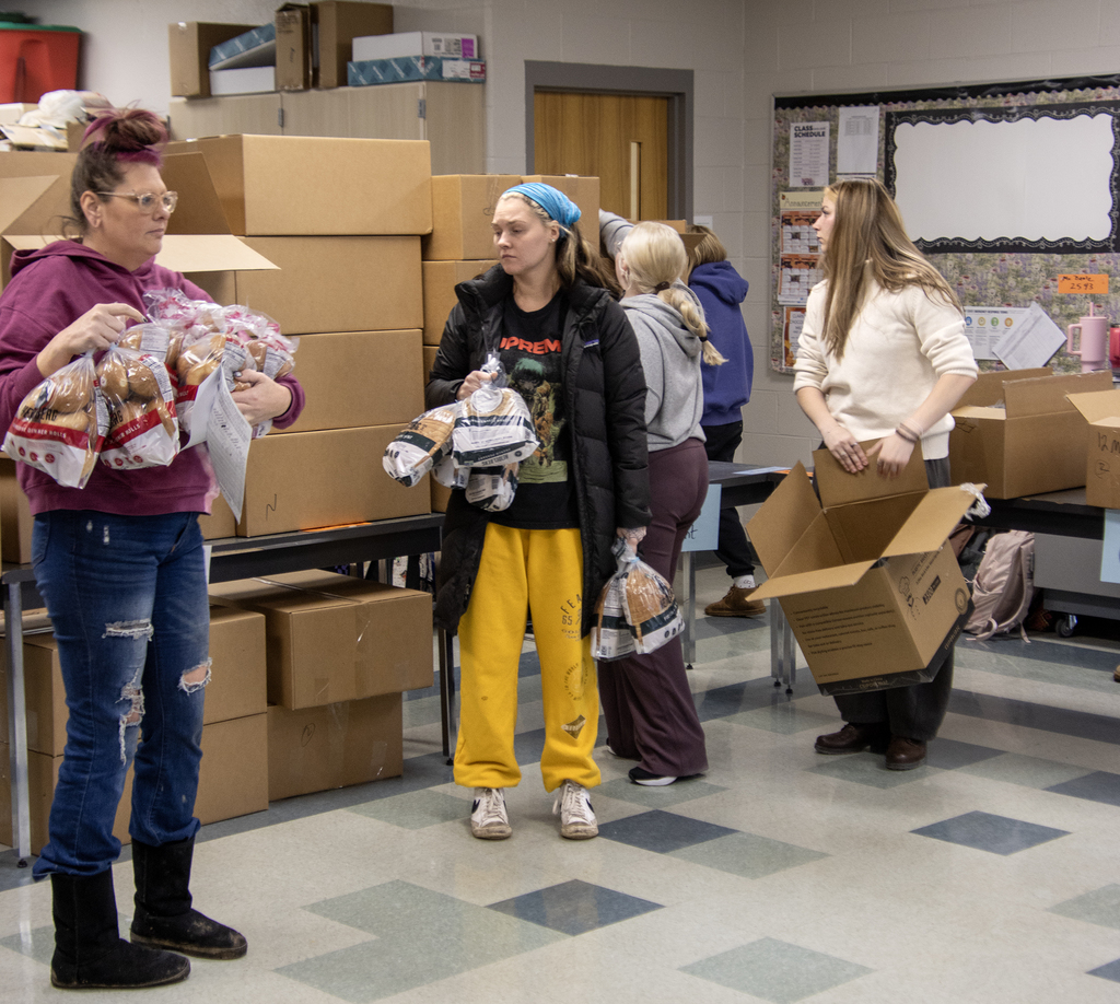 students organize bread orders for delivery