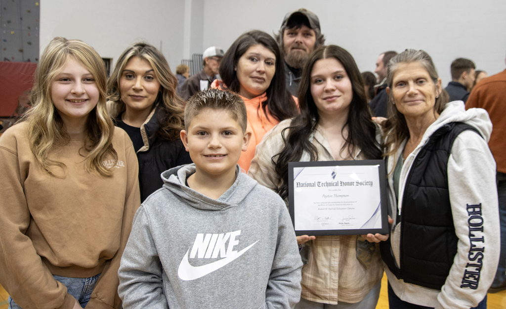 family poses with NTHS inductee