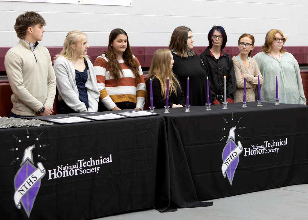 students lighting candles