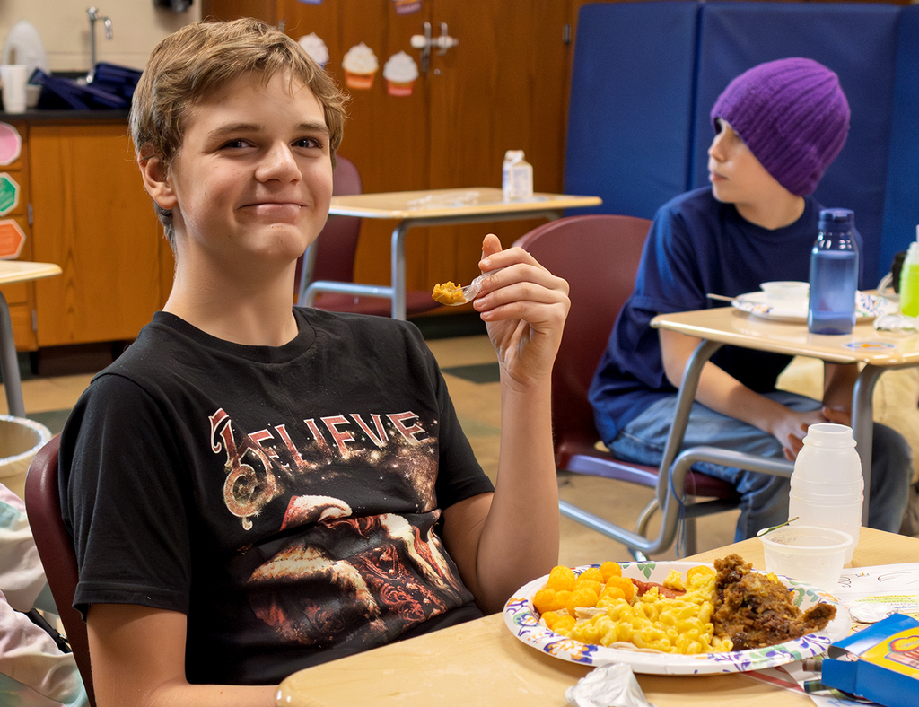 smiling student with food