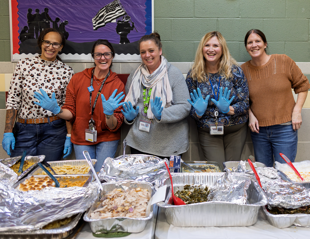 staff servers smiling