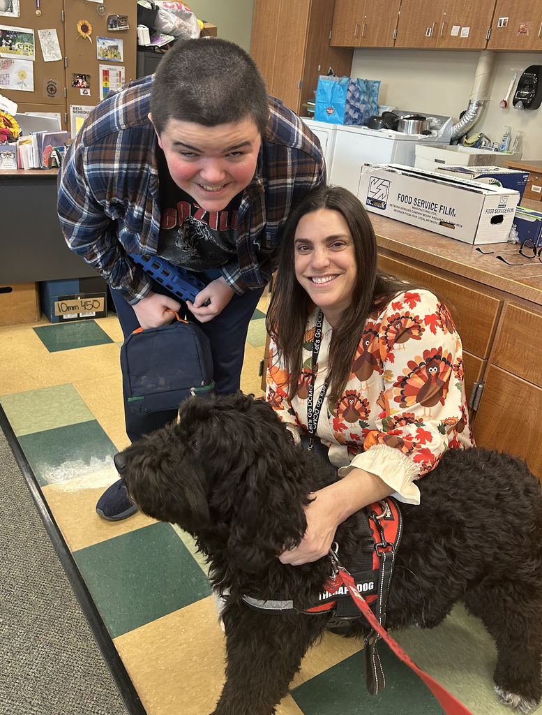 student with. therapy dog