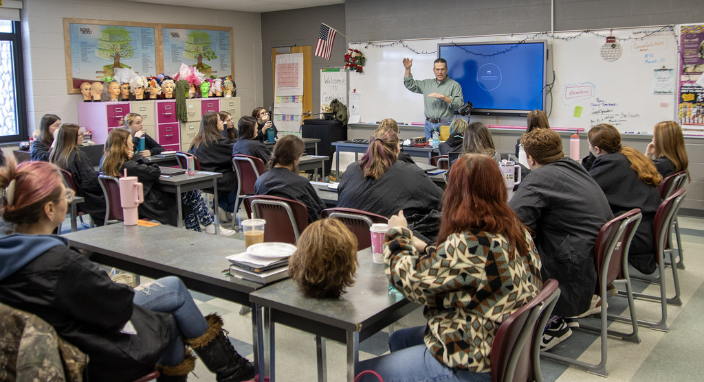 To Perkins from b sharp speaks to cosmetology students in classroom
