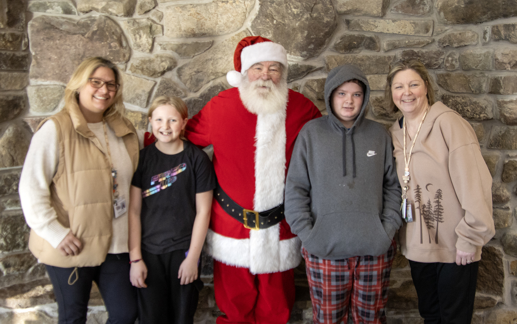 Santa wit 2 students and 2 staff