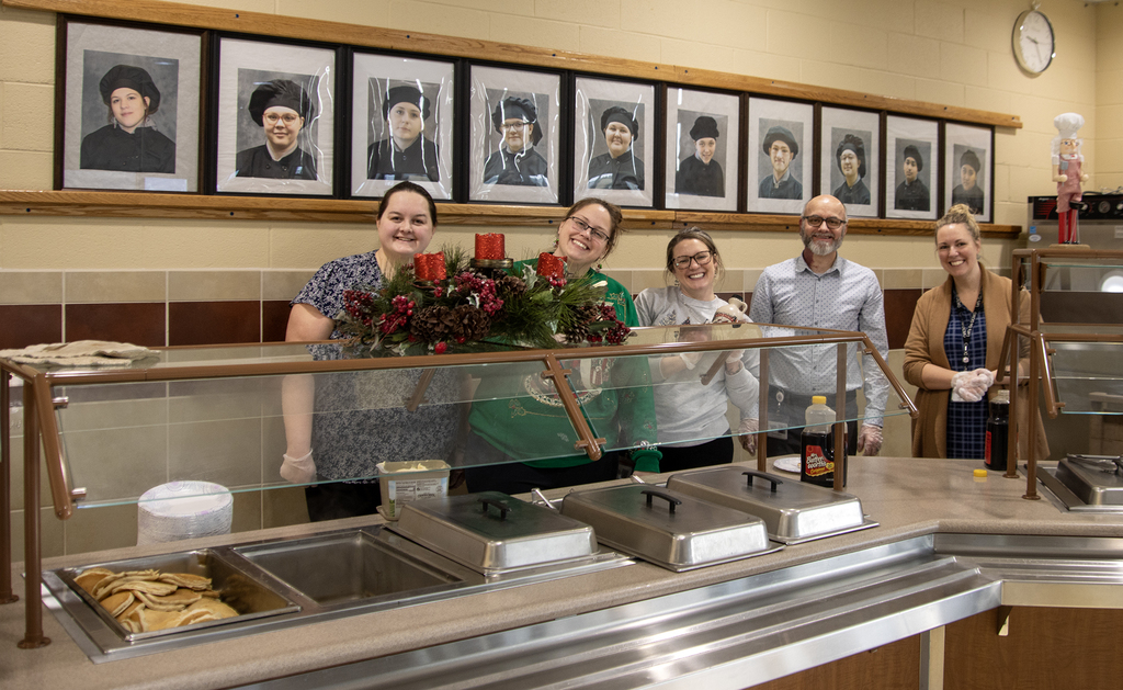 Support Services Center staff serving pancakes
