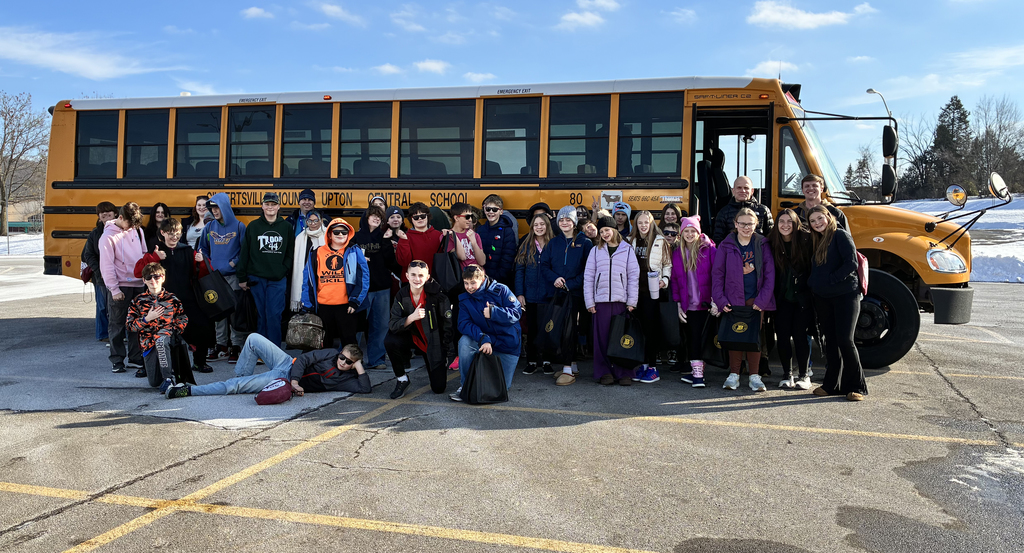 Gilbertsville-Mount Upton students pose in front of bus
