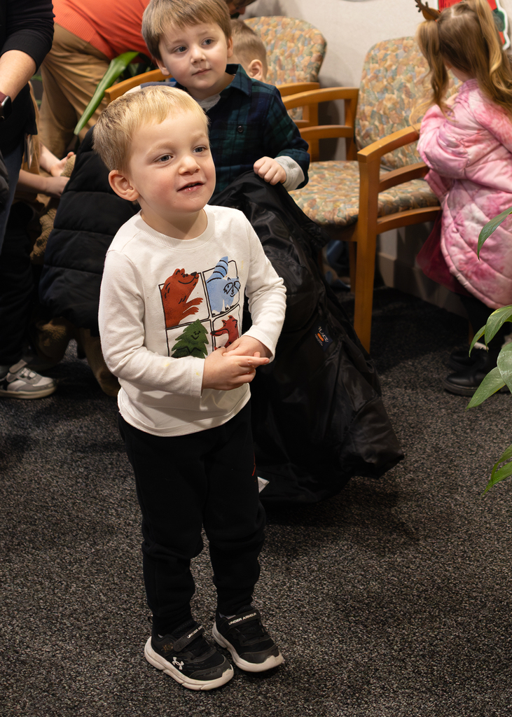 smiling child watching Grinch