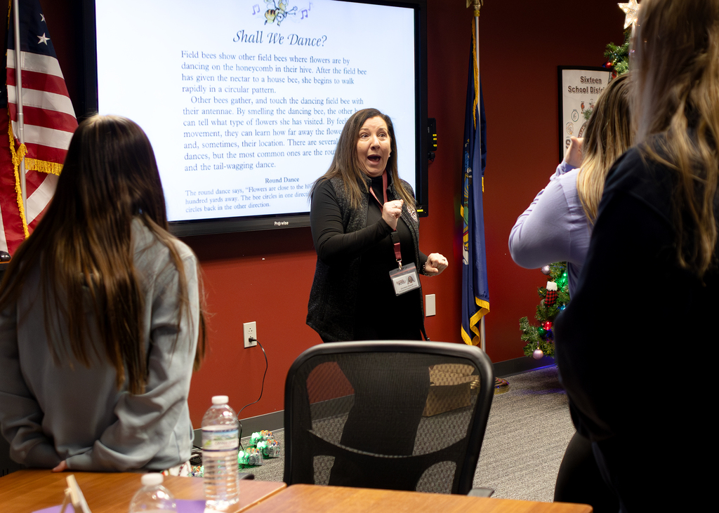 instructor leads students in a dance