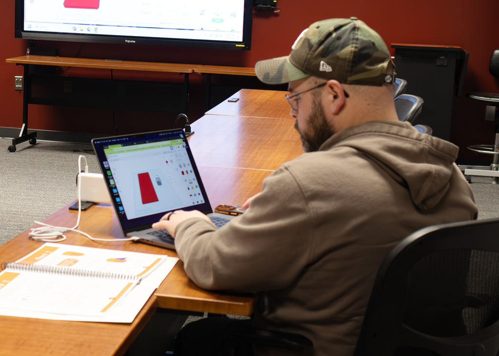 man working at computer