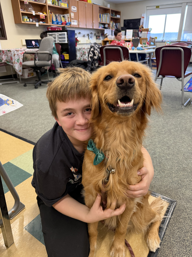 student hugs the dog
