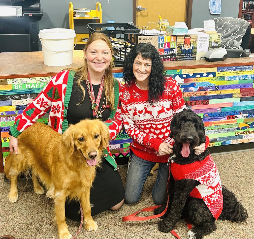 2 teachers and 2 dogs, in Christmas wear