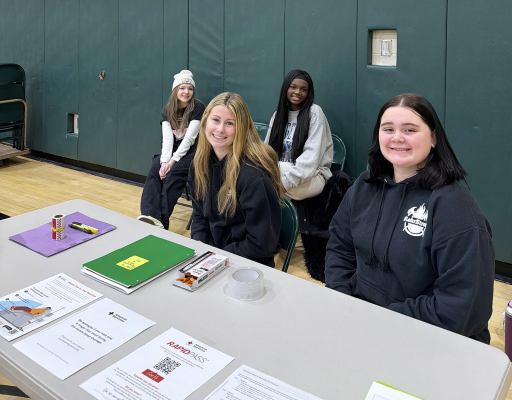 FBLA Volunteers at blood drive sign-in table