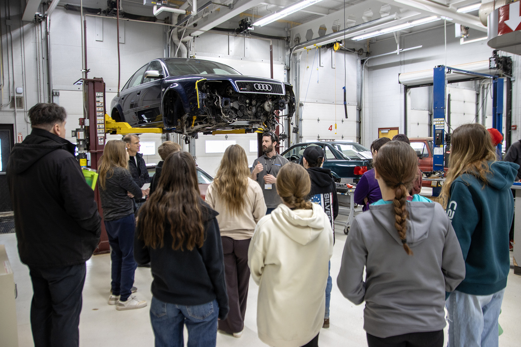 auto tech teacher speaks to group of students
