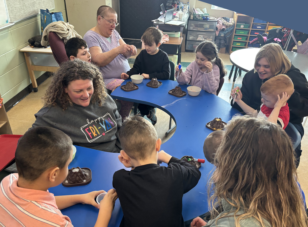 teachers helping students make fizzing volcanoes