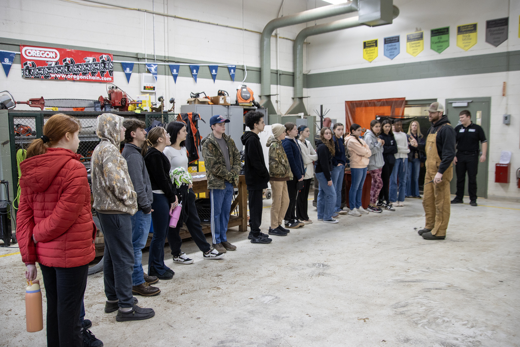 Conservation teacher speaks to visiting students