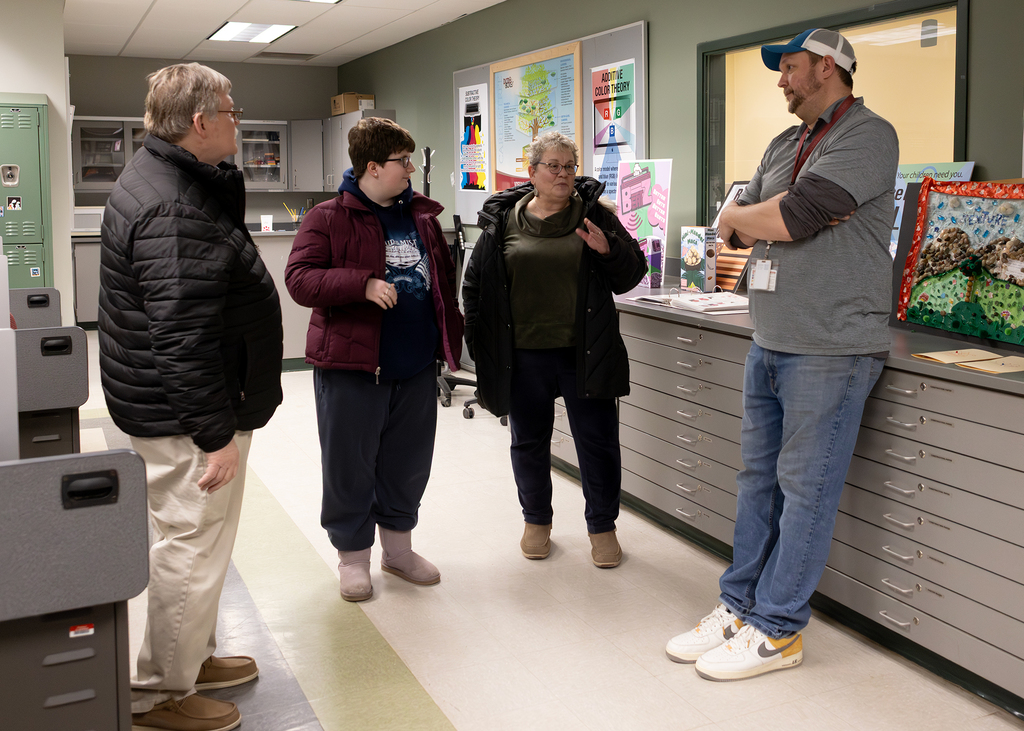 family speaks with Viscom teacher