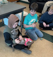 students with kid goat