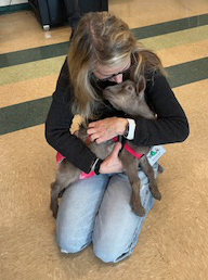 educator with kid goat