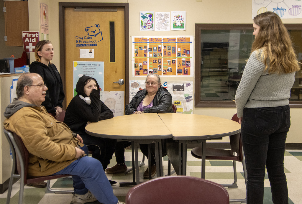 ECE teacher speaks to two students and their families