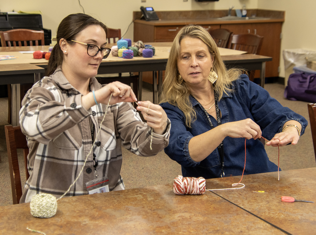 2 people working on crocheting