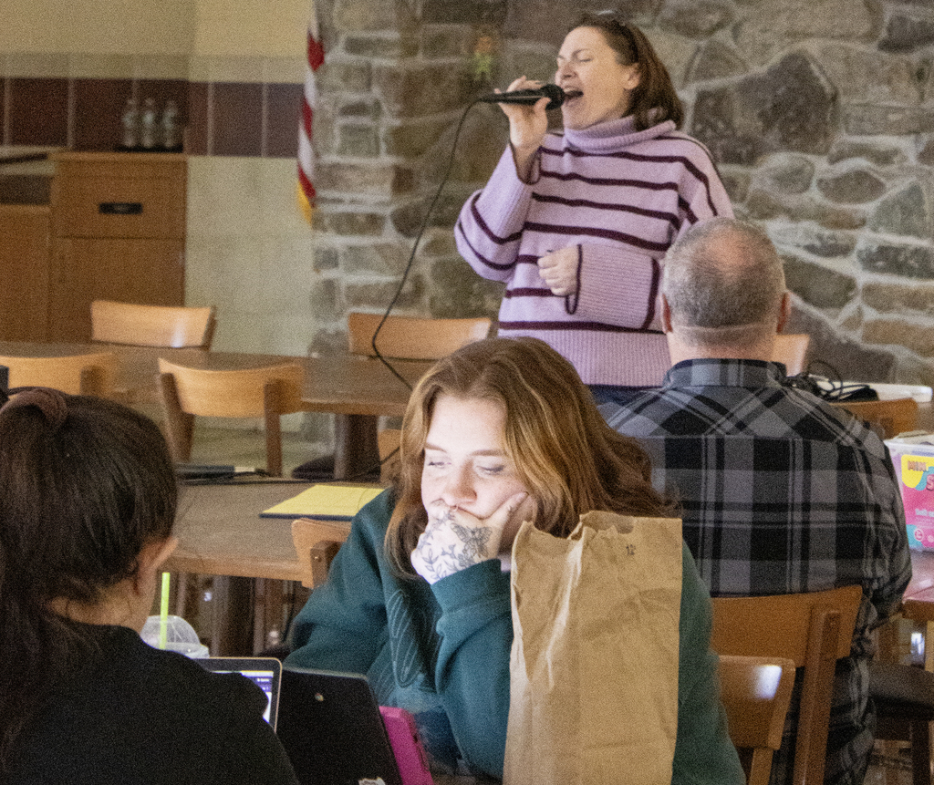 staff member singing in the kareoke contest
