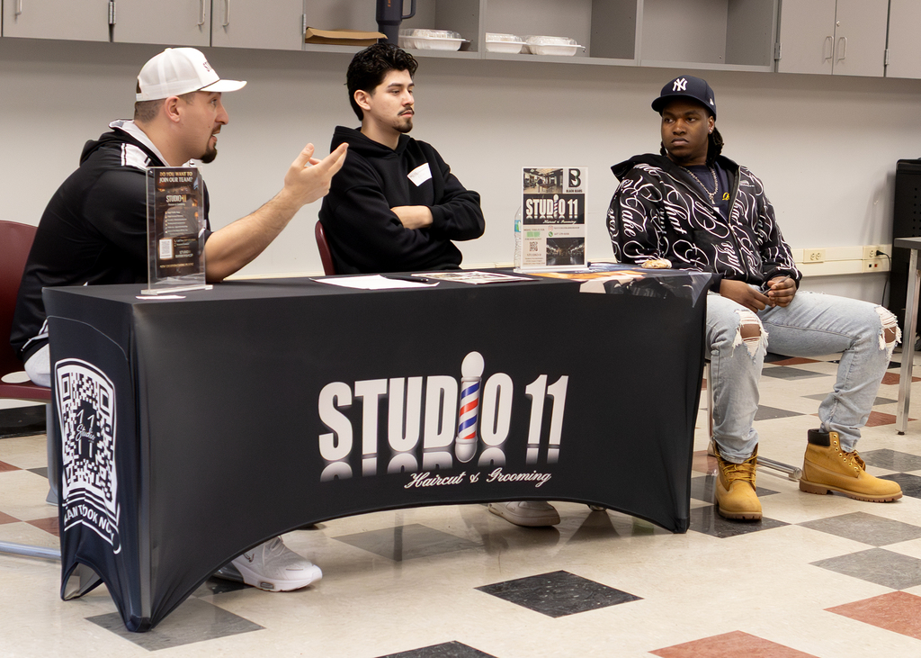 3 barbers from Studio II speak to students