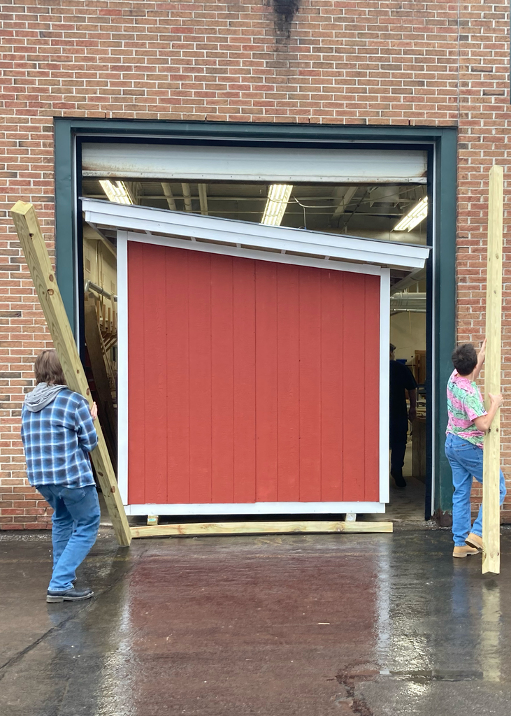 students levering a dugout