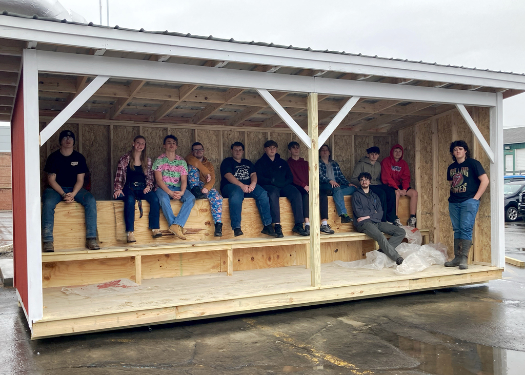 building construction class inside wooden dugout
