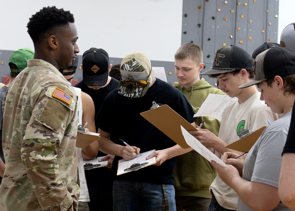 students and a National Guard recruiter at the college & career fair