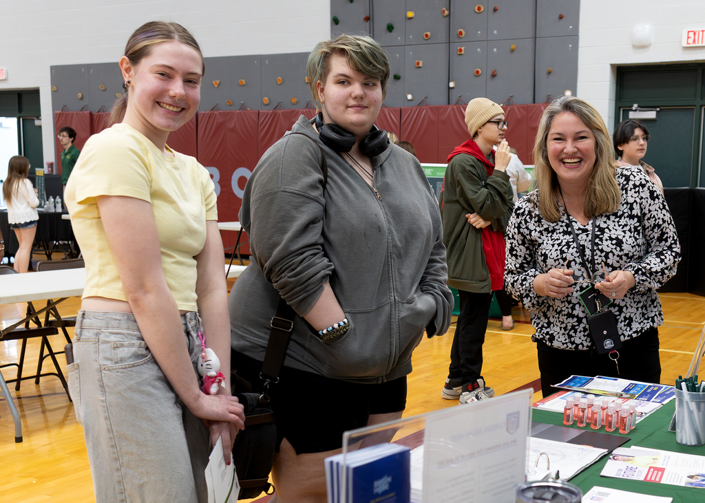 2 students and a recruiter at the college & career fair