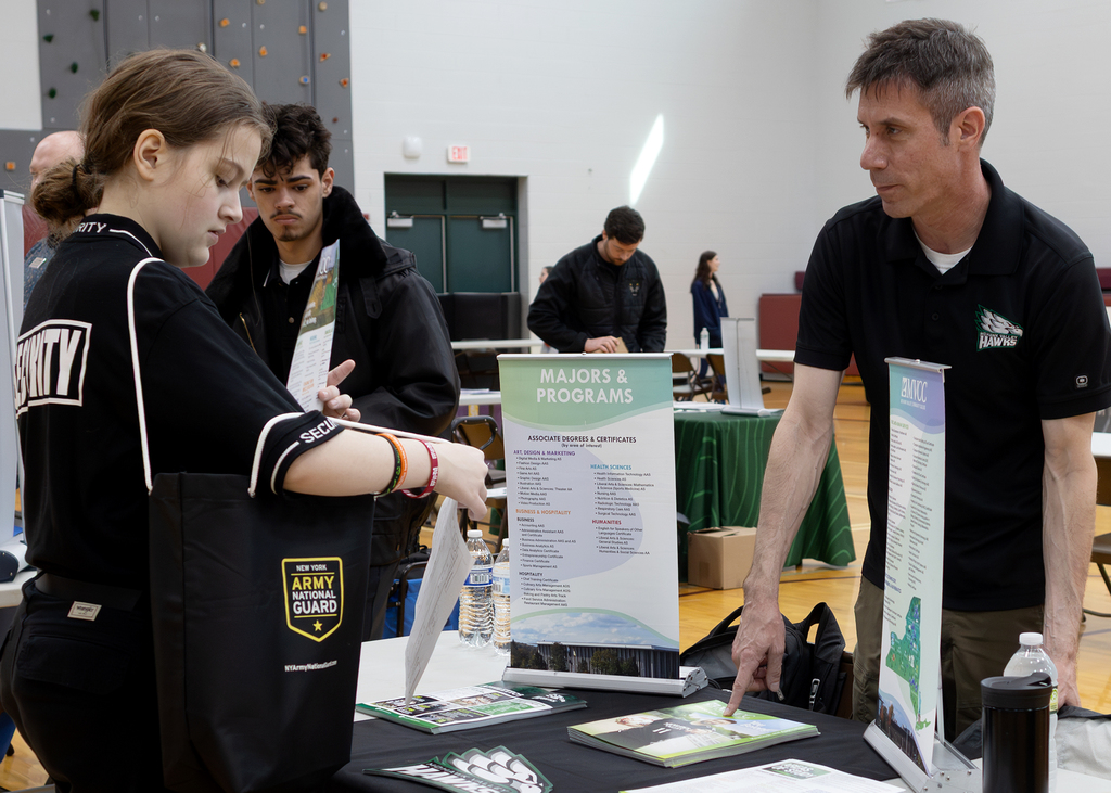 2 students and a recruiter at the college & career fair
