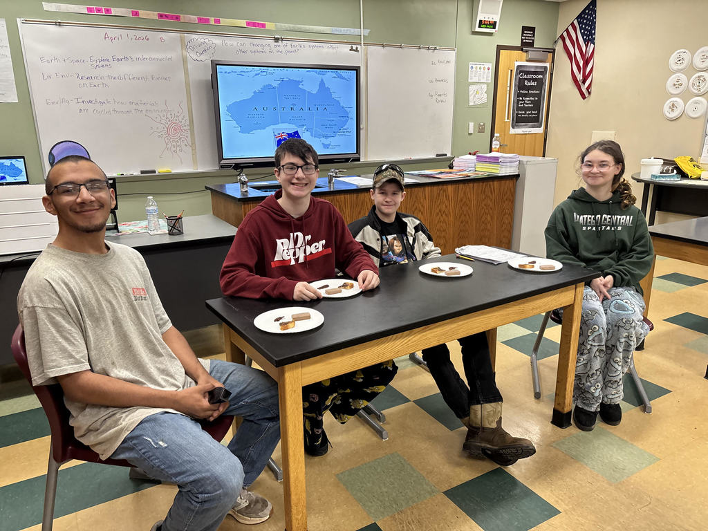4 students with snacks from Australia