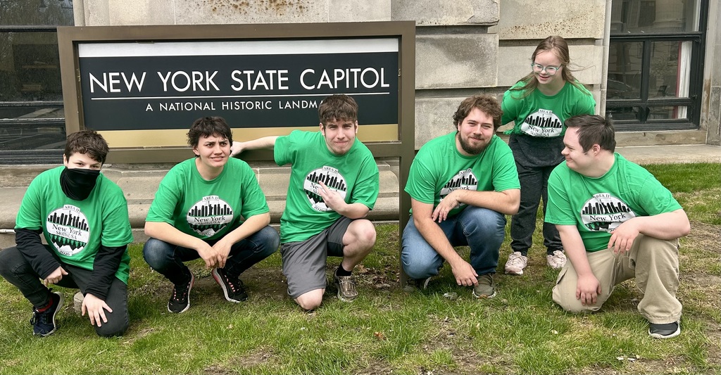 Group picture in front of capitol sign