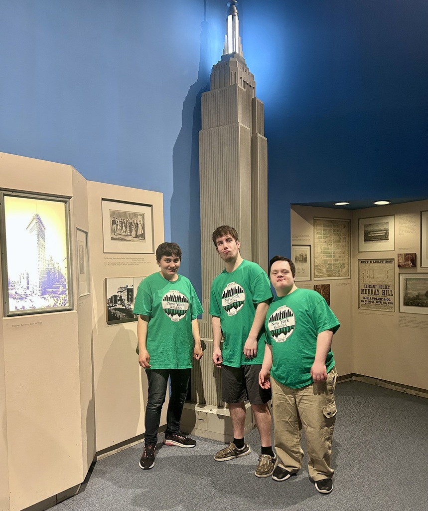 3 students pose at NYS Museum