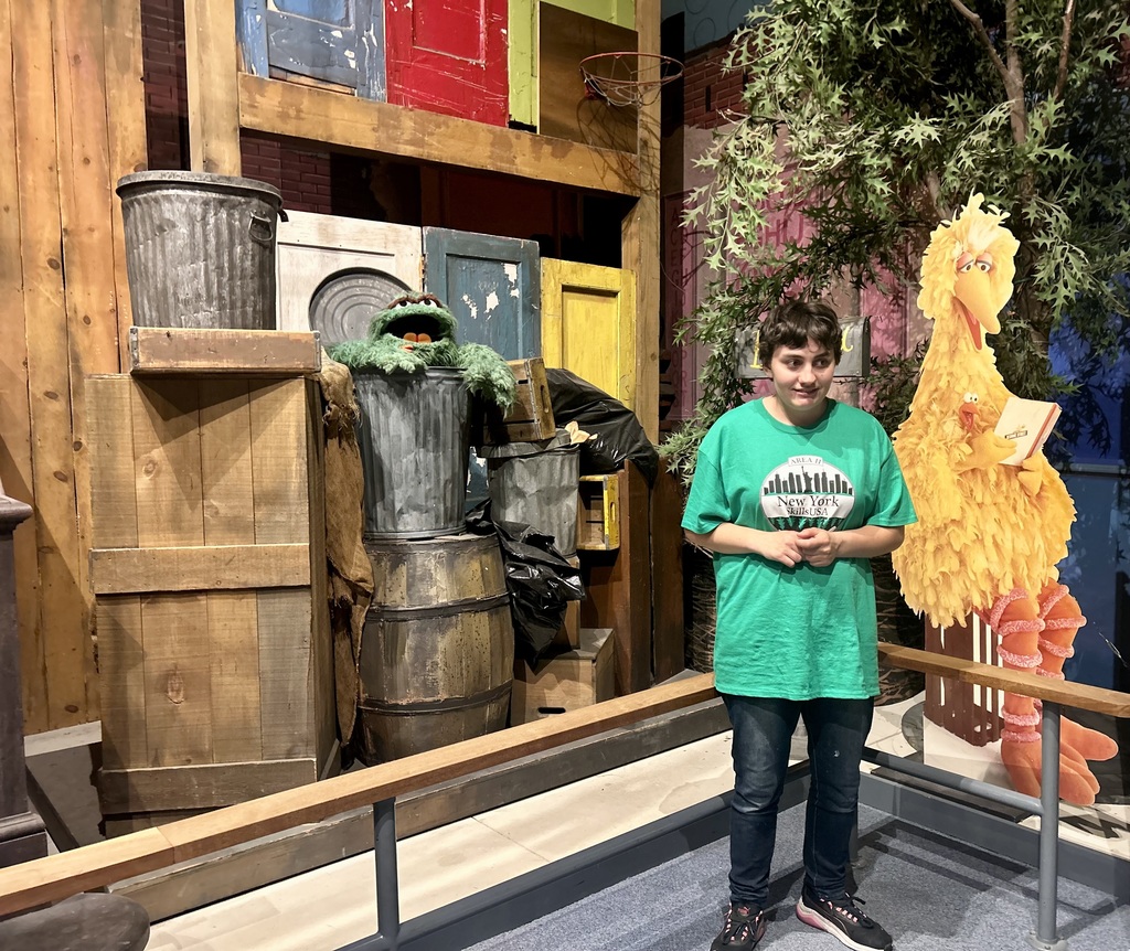 student on Sesame Street set at NYS Museum