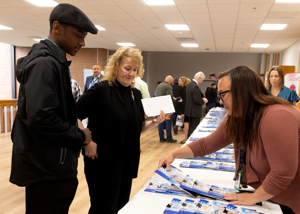 student arrives at recognition event