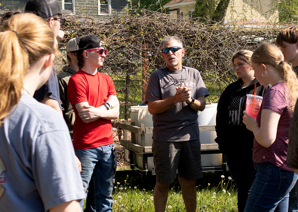 Mr. Foster giving auto tech students some instructions