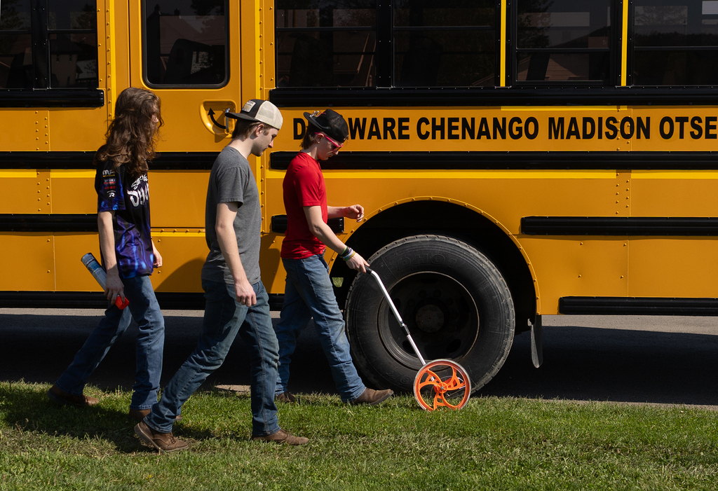 auto tech students measuring distances