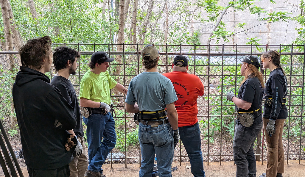 Corey Mossow, Training Coordinator and Business Agent for the Ironworkers Local 60, demonstrates for students at the training center