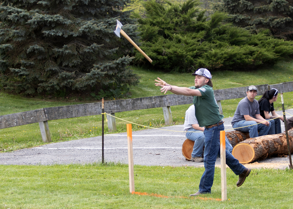 student throwing an ax
