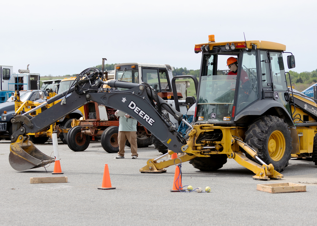 student operating an excavator