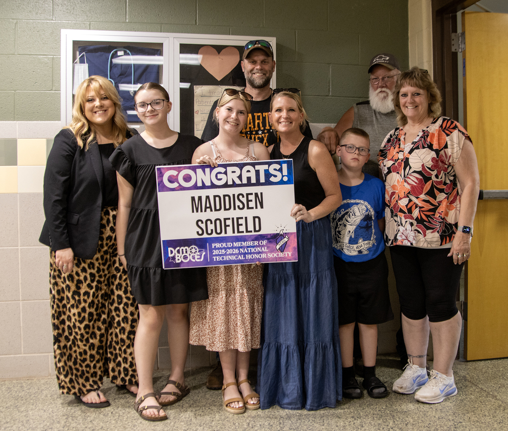 Student Madison Scofield poses with family members