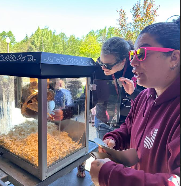 volunteers serving fresh-popped popcorn