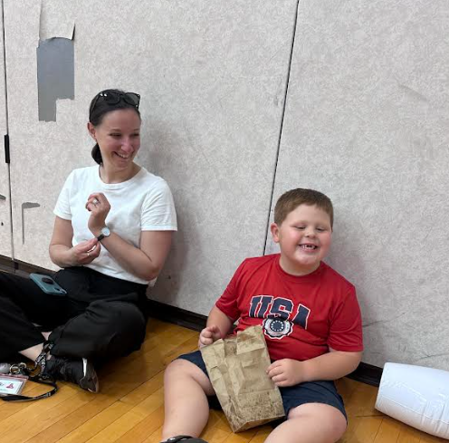 student enjoying a bag of popcorn