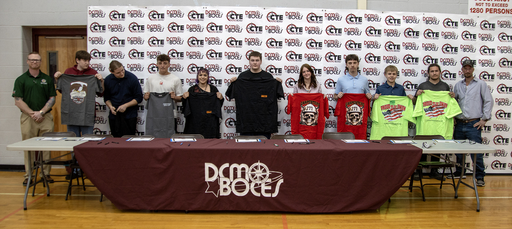 students with t-shirts from their future employer
