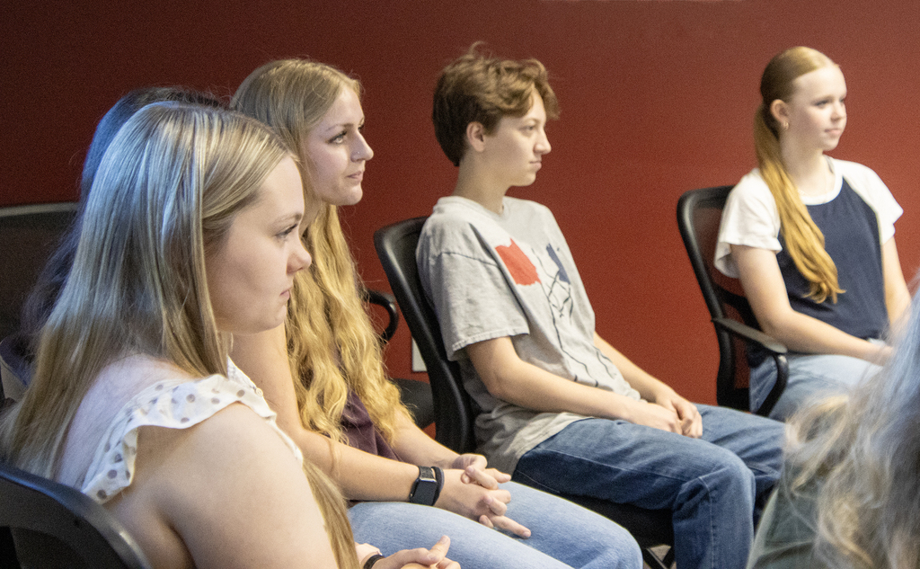 4 students listening
