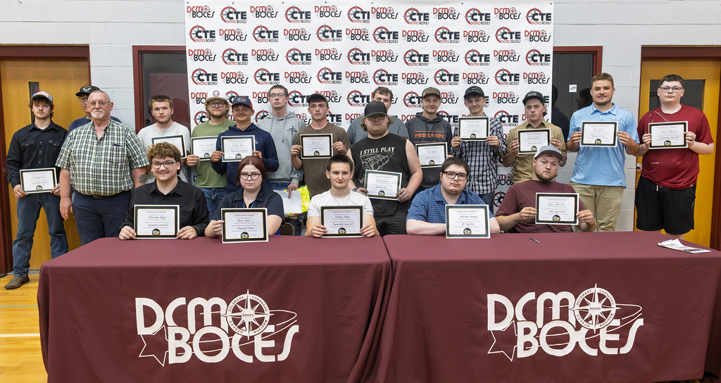 students pose with their certificates