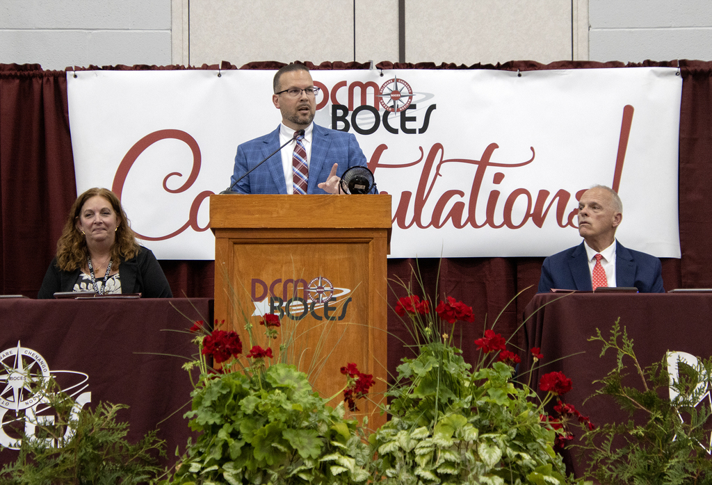 superintendent speaking from lectern