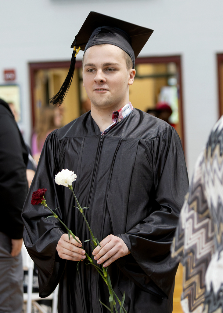 smiling student in cap and gown